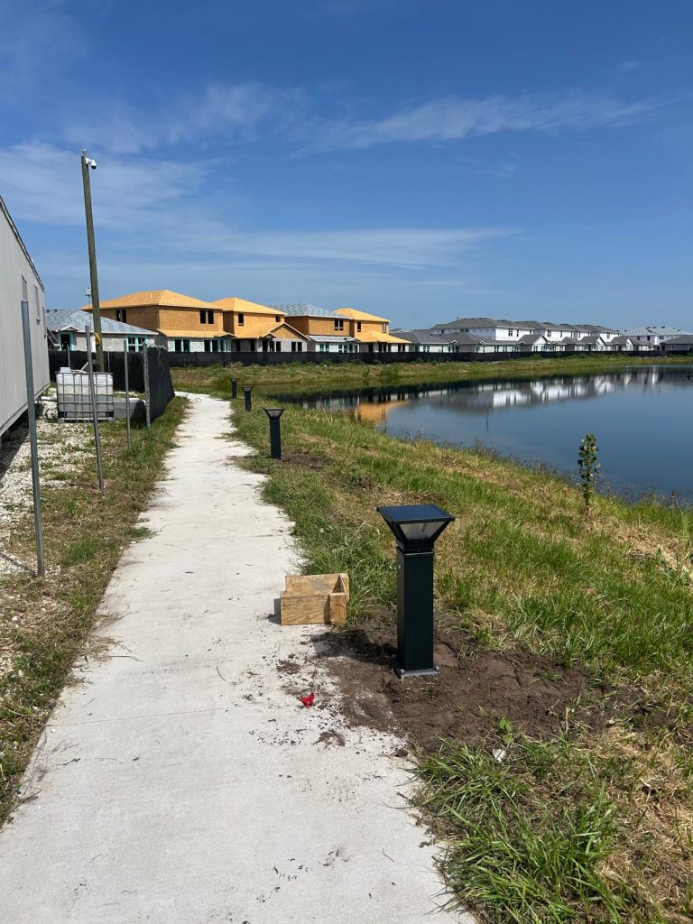 Solar bollard lights along a community walking path
