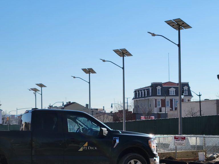 Solar street lights above an urban parking area